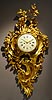 An extremely beautiful Louis XV gilt bronze grand cartel clock of eight day duration, signed on the white enamel dial Furet à Paris